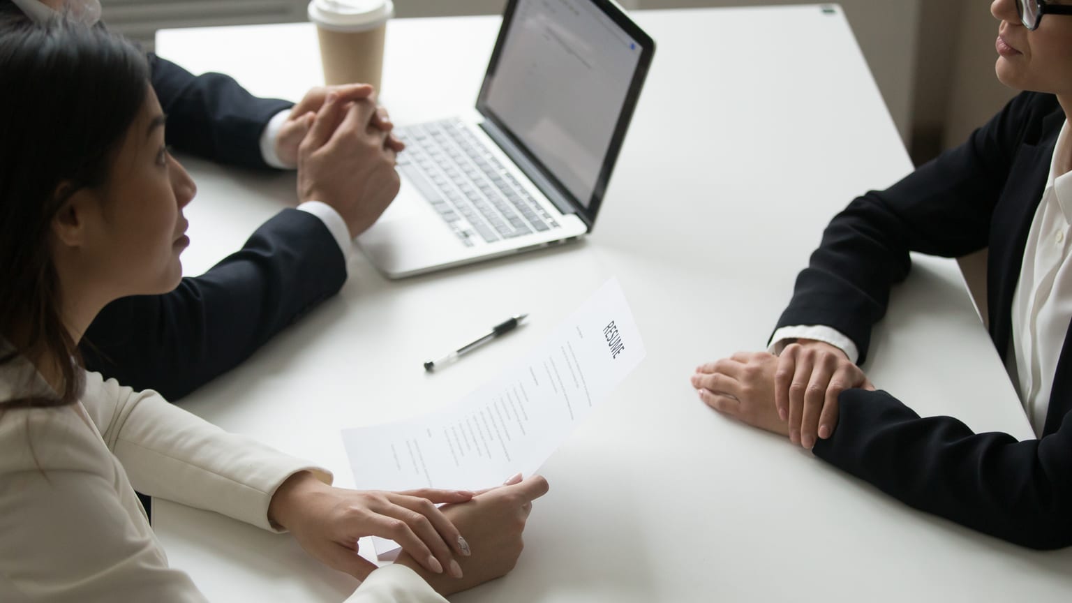 Two recruiters interviewing a candidate — the most common interview questions
