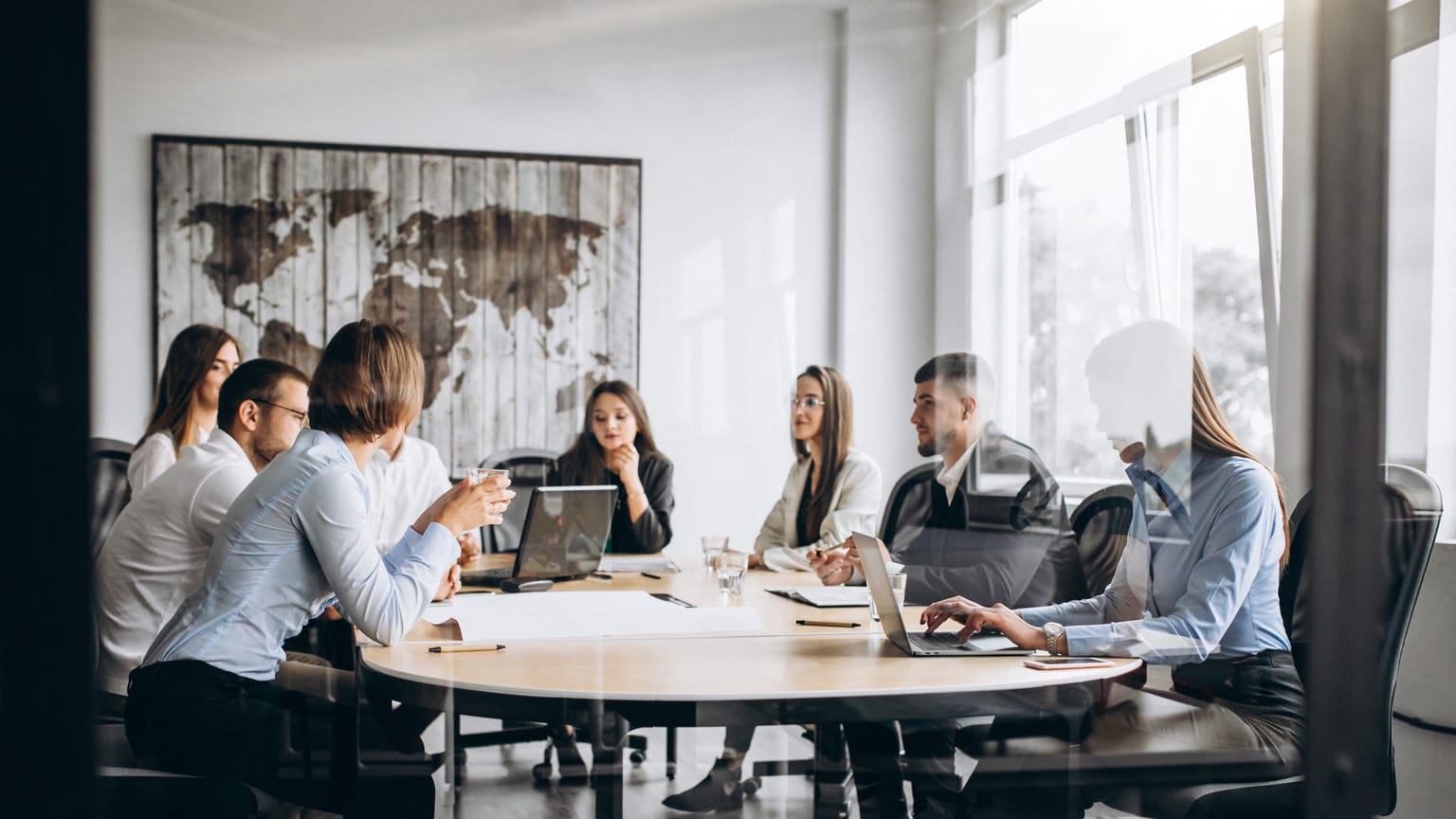A team meeting around an office table — job opportunities in Košice
